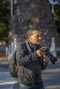 Latino photojournalist working on the street Royalty Free Stock Photo