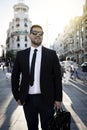 Latino poses in front of a building in Madrid Royalty Free Stock Photo