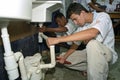 Latino teens learn profession plumbing, trade school