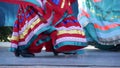 Latino women in colourful traditional dresses dancing Jarabe tapatio, mexican national folk hat dance. Street