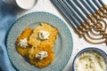 Latkes and curd cheese on a plate and on a blue napkin, chanukia Royalty Free Stock Photo