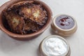 Latkes sour cream and jam from side Royalty Free Stock Photo