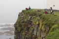 Latrabjarg bird cliffs, West Fjords, Iceland. Tourists taking pictures of bird life. Royalty Free Stock Photo