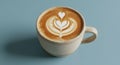 Latte art in a beige ceramic mug on a light blue surface. The art Royalty Free Stock Photo