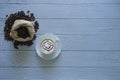 Latte art coffee in a coffee cup on coaster and coffee beans isolated with sack bag on top left corner Royalty Free Stock Photo