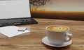 Latte Art coffee in white cup on wooden surface table. Blur blank screen labtop , Black smartphone  and white sheet on table. Copy Royalty Free Stock Photo