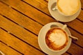 Latte art concept. Two cups with cappuccino Royalty Free Stock Photo