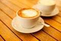 Latte art concept. Two cups with cappuccino Royalty Free Stock Photo