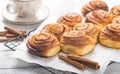 Latte or cacao and Cinnamon Bun for breakfast or break on white background. Cup of coffee and homemade buns Royalty Free Stock Photo