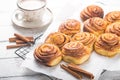Latte or cacao and Cinnamon Bun for breakfast or break on white background. Cup of coffee and homemade buns Royalty Free Stock Photo