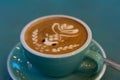 Latte coffee with latte art in a coffee cup with tea spoon Royalty Free Stock Photo