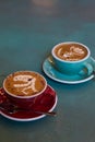 Latte coffee with latte art in a coffee cup with tea spoon Royalty Free Stock Photo