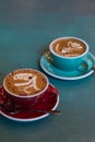 Latte coffee with latte art in a coffee cup with tea spoon Royalty Free Stock Photo