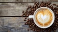 latte cup in a closeup view against a rustic wooden table Royalty Free Stock Photo