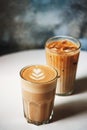 Latte and ice latte in coffee glasses on table in cafe. Royalty Free Stock Photo