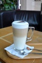 Latte Macchiato On Glass Cup On A Wooden Table Royalty Free Stock Photo