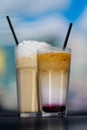 Latte with whipped cream and milky berry cocktail with blackberries and caramel Royalty Free Stock Photo