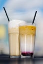 Latte with whipped cream and milky berry cocktail with blackberries and caramel Royalty Free Stock Photo