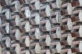 Lattice dilapidated balconies of the standard rooms of the old unfinished hotel as background or backdrop