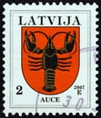 LATVIA - CIRCA 2007: A stamp printed in Latvia from the `Coat of Arms` issue shows Auce coat of arms, circa 2007. Royalty Free Stock Photo