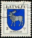 LATVIA - CIRCA 1994: stylized Elk (Moose) Coat of Arms of Zemgale, Coats of Arms of Latvian Towns and Municipalities Royalty Free Stock Photo