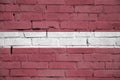 Latvia flag is painted onto an old brick wall Royalty Free Stock Photo