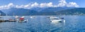 Alpine Lake Como summer panorama with ships and boats and the mountains overlooking the lake. Royalty Free Stock Photo