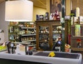 Interior of wine counter with vintage style wooden showcase and cash desk.