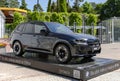 JUNE, 2023: Exhibition and sale of new BMW X6 black cars at the stand near the Dzintari Concert Hall