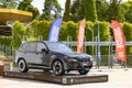 Exhibition and sale of new BMW X6 black cars at the stand near the Dzintari Concert Hall in Majori