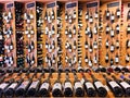 Interior of modern wine boutique store with vintage style wooden luxury showcases.