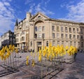 Yellow Wind Spinners installed in front of the facade of historic Latvian Radio building