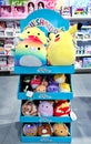 Children\'s section with a variety of colored soft toys on a stand for children in SKY and MORE shopping mall