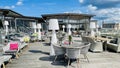 An open veranda of the restaurant with white wicker furniture