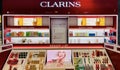 Shelves with popular cosmetics Clarins brand