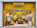 Modern interior in yellow colors of L`Occitane En Provence skincare boutique in shopping mall, Riga Royalty Free Stock Photo