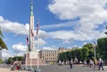 Freedom Monument with Latvian national flags on the central square of the Riga Old Town Royalty Free Stock Photo
