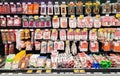 Shelves with various meat products in big food section in hypermarket, Riga. Latvia.