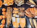 Showcase with various smoked fish products in delicatessen section, Riga