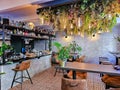 Bar counter with coffee machine and shelf with alcoholic drinks in Riga Old Town cafe.