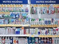 A large selection of tooth pastes, tooth rinse and oral care products on shelves in shopping mall