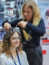 Master hairdresser conducts a master class on hair styling at a Beauty Exhibition in Riga