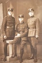 Latvia - 1930s: An antique photo shows three soldiers posing in front of camera