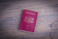 Latvian european passport on dark wood background Royalty Free Stock Photo