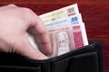 .Latvian money in the black wallet