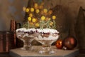 Latvian, scandinavian traditional rye bread layered dessert with whipped cream and cowberry jam served in glass on the Christmas