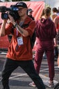 Latvian Television camera operator working at the public mass event: