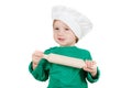 Laughable little boy kneading dough for the cookies, isolated on white