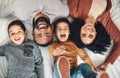 Laughing, above and portrait of a family on a bed for relaxation, bonding and quality time. Playful, smile and carefree Royalty Free Stock Photo