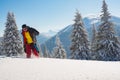 Laughing adventurer is running in the winter mountains Royalty Free Stock Photo